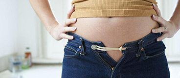 stomach with burst trouser button